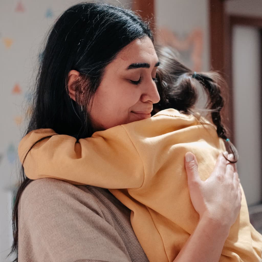 Parent and child sharing a warm embrace