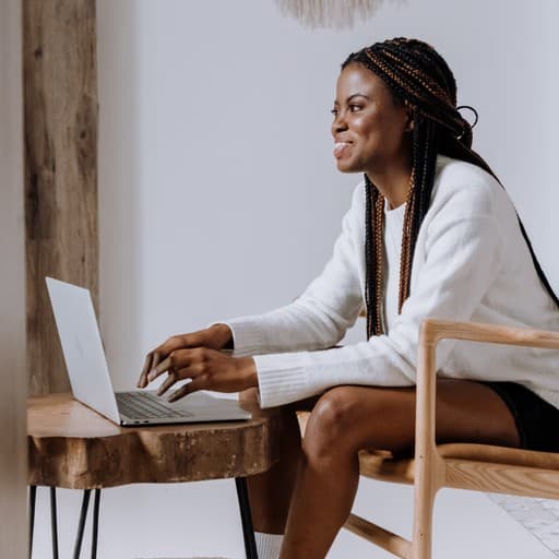 Woman typing on a laptop