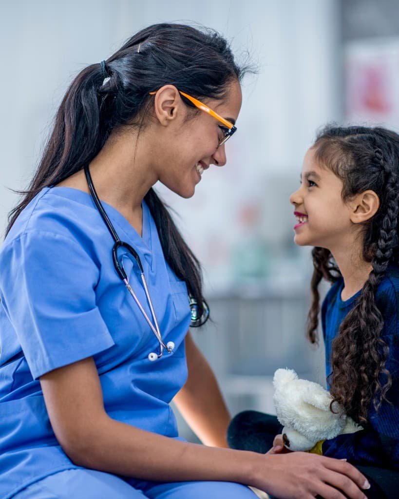Therapist connecting warmly with a child during an appointment